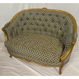 A good quality French-style two-seat settee with gilt curved frame upholstered in button fabric