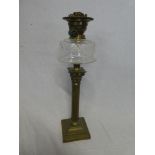 A good quality brass Corinthian column oil lamp with cut glass reservoir,