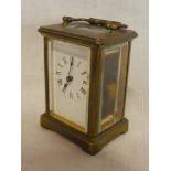 A French carriage clock with rectangular enamelled dial in brass traditional glazed case