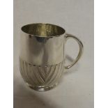 A Victorian silver tankard with gadrooned decoration and loop handle, London marks 1880,