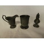 A 19th Century pewter pedestal cream jug with scroll handle,