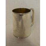 A Victorian silver pint-size tankard with engraved leaf decoration and loop handle,