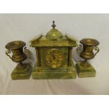 An impressive mantel clock with gilt circular dial in brass mounted onyx pavilion style case