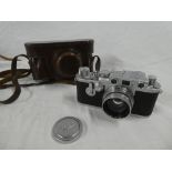 A Leica 1c camera No.563574 marked "Leica D.B.P.