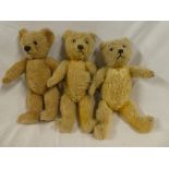 Three various plush covered teddy bears