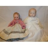 A child's old porcelain headed doll by Armand Marseille and one other composition doll (2)
