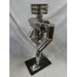 An unusual 1960's stainless steel commercial display figure modelled as a walking robot and