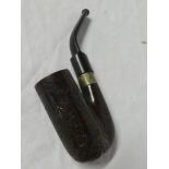 An unusual Boer War smokers pipe carved with the badge of the Royal Welch Fusiliers with numerous