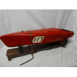 A fibreglass model racing boat based on a 1920's/30's design with petrol fuelled engine and remote