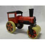 A tin plate clockwork steam roller