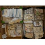 Three boxes containing a large selection of packets of GB and World stamps on/off paper