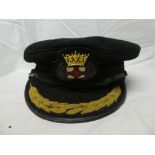 A Shipping Line Officers peaked cap with embroidered badge by Wood & Sons,