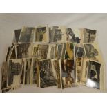 A selection of various black and white and coloured postcards,