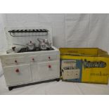 A vintage Vulcan tin plate cooker/stove with up-stand and accessories in part original box