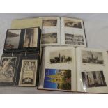 Three albums of black & white and coloured postcards including views of Cornwall,