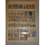 A stock book containing a collection of Italy stamps 1860's - 1980's