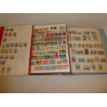 Two stock books and a folder containing a selection of mixed stamps including Austria, Norway,