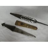 An old African dagger with double edged blade and horn hilt in carved wood sheath and an African