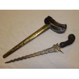 An old Eastern Kris dagger with 12½" watered steel wavy blade,