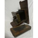 An old brass mounted mahogany adjustable plate camera by Jenome