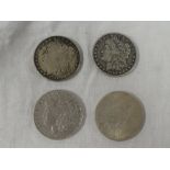 Four American silver dollars including 1888, 1891,