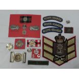 A collection of Scots Guards badges and insignia including a pair of Officers embroidered wire full