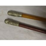 Two Military swagger sticks with nickel mounted tops for the Wiltshire Regiment and Suffolk