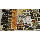 A large selection of Royal Marine insignia including numerous "Royal Band" titles;