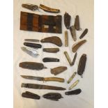 A selection of various Military jack knives, other folding knives, garden pruning knives,