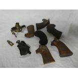 A part modern eprouvette tinder lighter, various pistol grips, Eastern oil bottle,