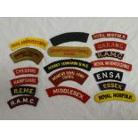 A selection of cloth shoulder titles including Woman's Transport Service F.A.N.Y.