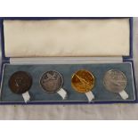 A cased set of four Battle of Britain Commemorative medallions dated 1930 in bronze,