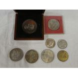 An American 1887 silver dollar, 1972 National Motor Museum cased silver medallion; 1951 crown,