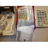 A boxed folder album containing a collection of USA stamps, various loose USA stamps,