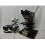 A Vickers Photoplan M41 photographic microscope system with four lens turrets and accessories