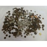 A large selection of GB and Foreign coins including some silver examples