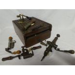 A selection of mainly 19th Century cartridge reloading equipment including unusual mahogany powder