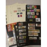 Various album pages and stock sheets containing a collection of Guernsey stamps, mainly un-mounted,
