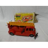 A Tri-ang Minic series 2 Fire Engine in original box complete with firemen (bell missing)