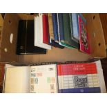 Sixteen albums and folders containing a collection of mixed World stamps