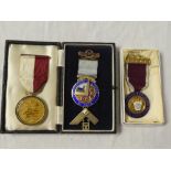 Three various silver gilt and enamelled Masonic medals including Woodford Lodge,
