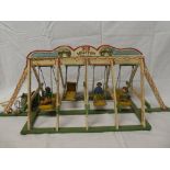 An old wooden scale built fairground swing boat ride (af)