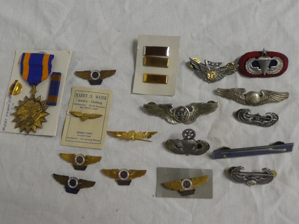 A selection of US Army Air Force metal wings including Air Crew, Glider Troops, Auxiliary,