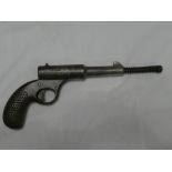 An old nickel plated gat-style air pistol
