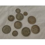A selection of various silver coins including 1889 silver half crown, South African 1937 half crown,