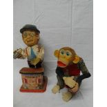 A Charlie Weaver battery operated bar tender figure and a similar monkey with cup