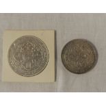 A Victorian 1899 silver trade dollar and a Straits Settlements 1907 silver dollar (2)