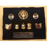 A small display of United States Air Force badges including parachute qualification insignia,