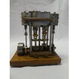 A scale built steel and brass vertical pumping engine,