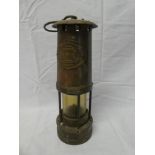 A brass Miner's lamp by E Thomas & Williams Ltd.